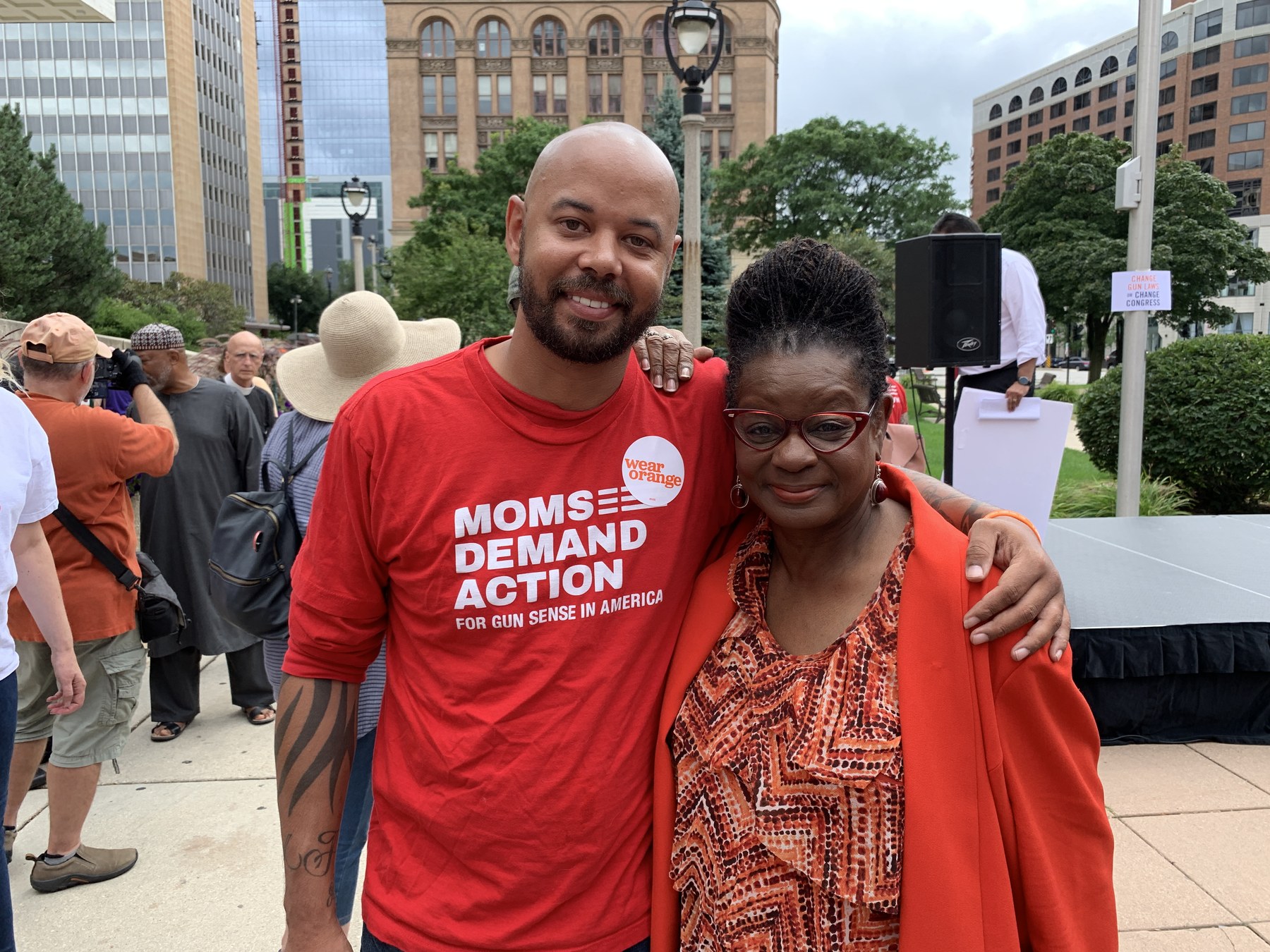Khary Penebaker with U.S. Representative Gwen Moore at a Wear Orange rally in Milwaukee