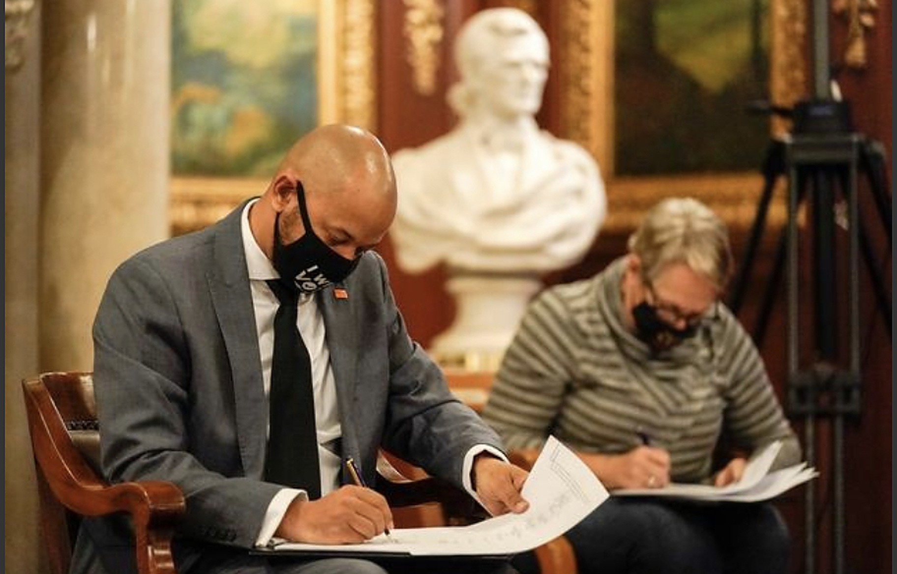 Khary Penebaker signing Electoral College vote documents at the Wisconsin State Capitol, 2020